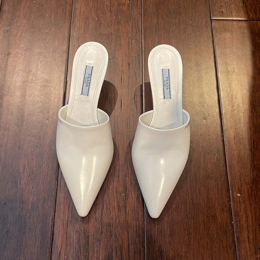 Prada logo pointed toe mules with a kitten heal